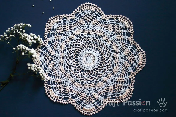 Create this beautiful Crochet Pineapple Doily with an exquisite puff stitch design. This free crochet doily pattern comes in written & chart patterns. 