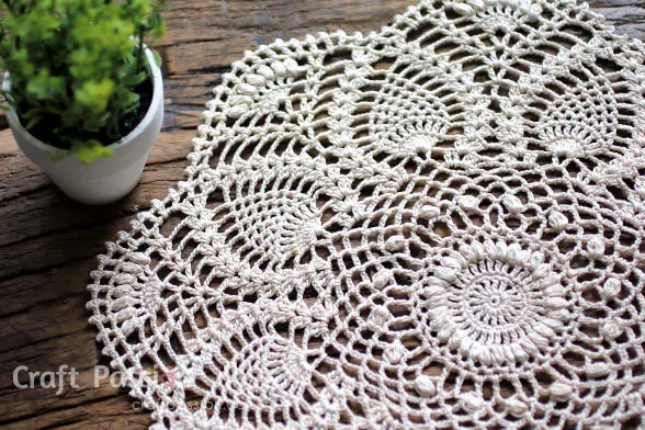 Create this beautiful Crochet Pineapple Doily with an exquisite puff stitch design. This free crochet doily pattern comes in written & chart patterns.