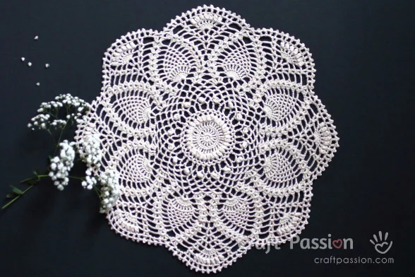 Create this beautiful Crochet Pineapple Doily with an exquisite puff stitch design. This free crochet doily pattern comes in written & chart patterns. 