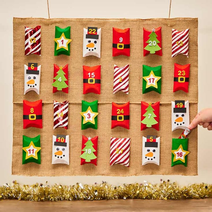 Countdown to Christmas with this homemade advent calendar made from toilet paper tubes! Fill each roll with small treats or messages, then decorate them with colored paper, stickers and glitter. Enjoy opening one each day leading up to Christmas.