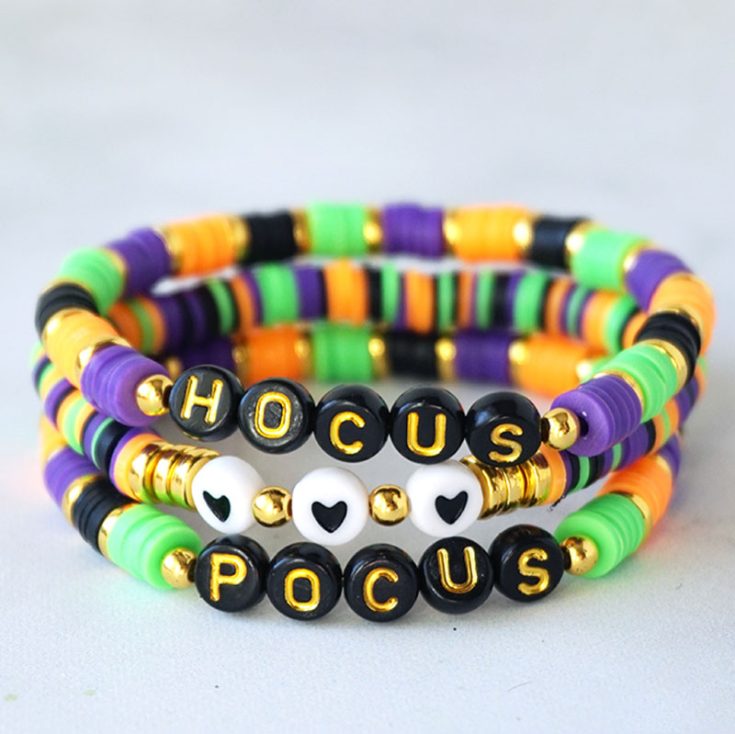 You are free to be as creative as you want with clay bead bracelet ideas! Especially themed ones. Here is a Hocus-Pocus themed bracelet for Halloween. They are so simple for kids of all ages to make, and it brightens up Halloween fashion, or you can hand them out as a Halloween party favor!