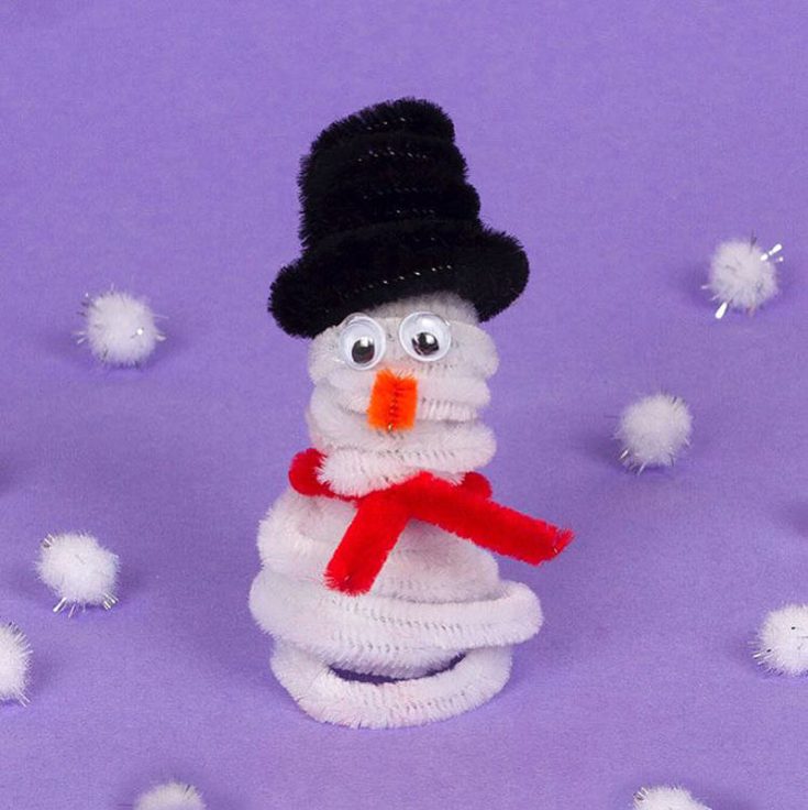 Build a snowman indoors with pipe cleaners. Customize the size of your snowman by using less or more pipe cleaners. With his carrot nose and top hat, this charming craft is perfect for adding a festive touch to your holiday decor.