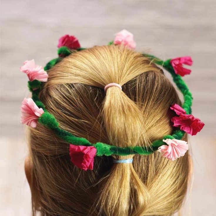Creating this head wreath is a delightful and budget-friendly way to feel pretty. Made from some pipe cleaners and colored tissue paper, it makes for a fun creation. Use pink for flowers or experiment with different colors following this tutorial.