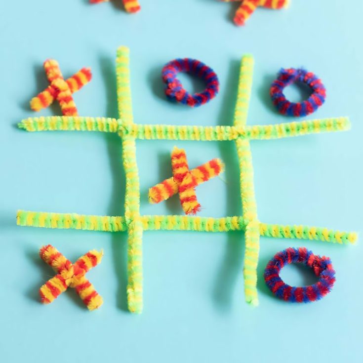 Play a classic game of Tic Tac Toe using pipe cleaners twisted into X&rsquo;s and O&rsquo;s and a makeshift grid. This portable and reusable game is perfect for travel or quiet evenings at home.