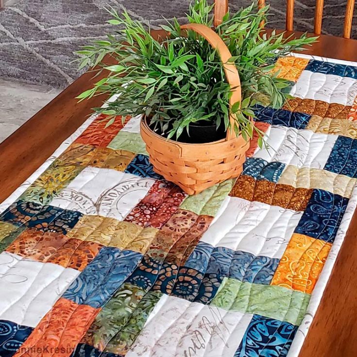 If you're looking for a fast and easy quilt runner project, this design is a must-have on your list. This runner is made with a charm pack and some additional fabric for the center squares. It's also scrap-friendly.&nbsp; Table runner size: 16" x 32"&nbsp;