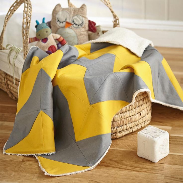 Learn to make this beautiful, simple mustard and grey baby quilt pattern here! It will add a pop of color to your baby&rsquo;s nursery, and its cheery design will allow your precious newborns to sleep in comfort and style. The finished size is 27&rdquo; x 40&rdquo;.