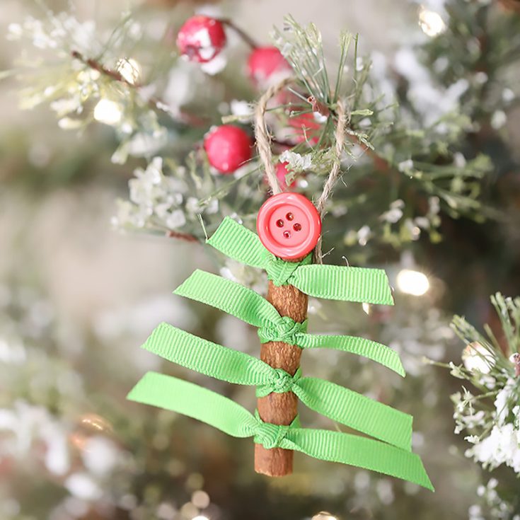 This dollar tree craft will blow your mind away! Not only is it simple but smells good! Use a cinnamon stick and transform it into an ornament that is unique and special to your tree!