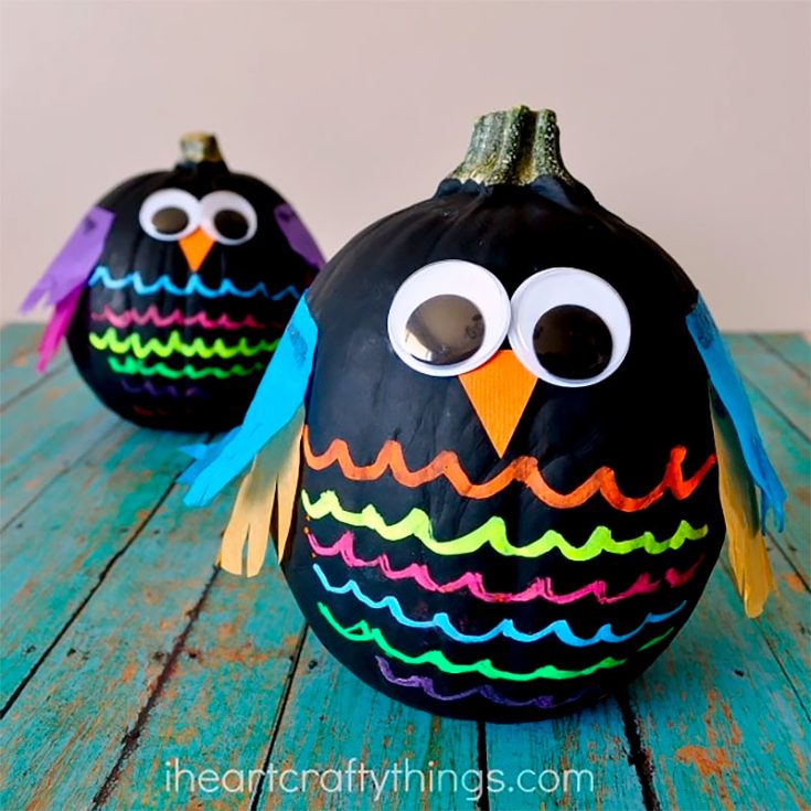 This owl pumpkin painting idea will be a fast favorite among the children. The black base makes it perfect for decorating for Halloween, and the pop of color from the liquid chalk and tissue paper truly made these feathered ones stand out.