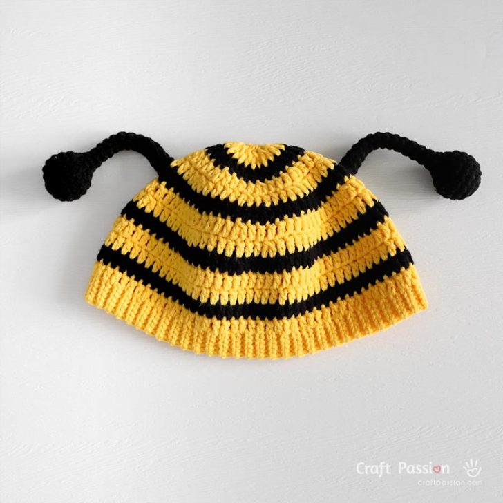 Adorable crochet bee hat for babies! Free pattern with photo tutorial, available in 4 sizes (3–24 months). Beginner-friendly and part of the Bee Costume Set with matching romper and wings.
