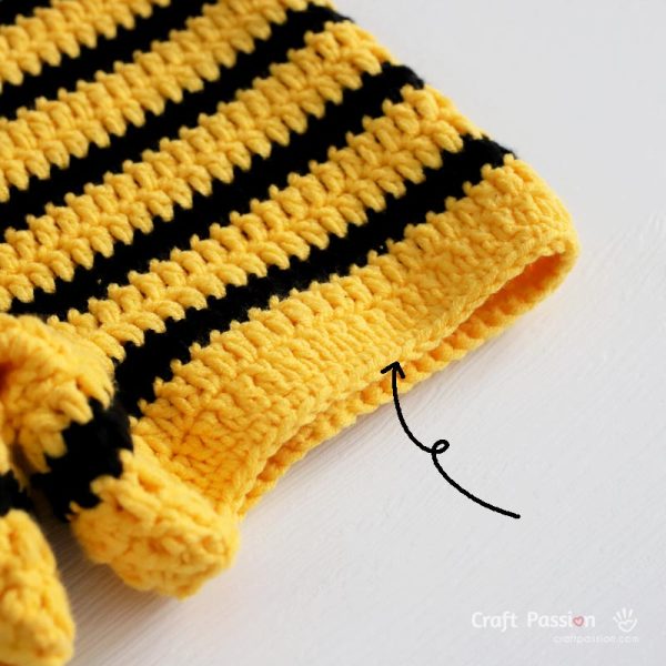 Work a neat single crochet edging all around the leg openings to give the bee romper crisp, tidy edges that hold their shape beautifully.
