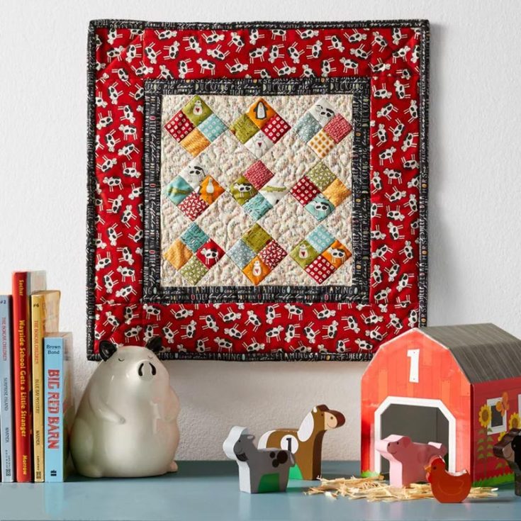 Don&rsquo;t you just love this cute mini baby quilt pattern? Though it is made for accent decor in your baby&rsquo;s nursery, it can also be upsized into a baby quilt! Featuring barn animals and warm colors, you will stitch up smiles for your little one in no time. The finished size is 15 &frac12;&rdquo; x 15 &frac12;&rdquo;.