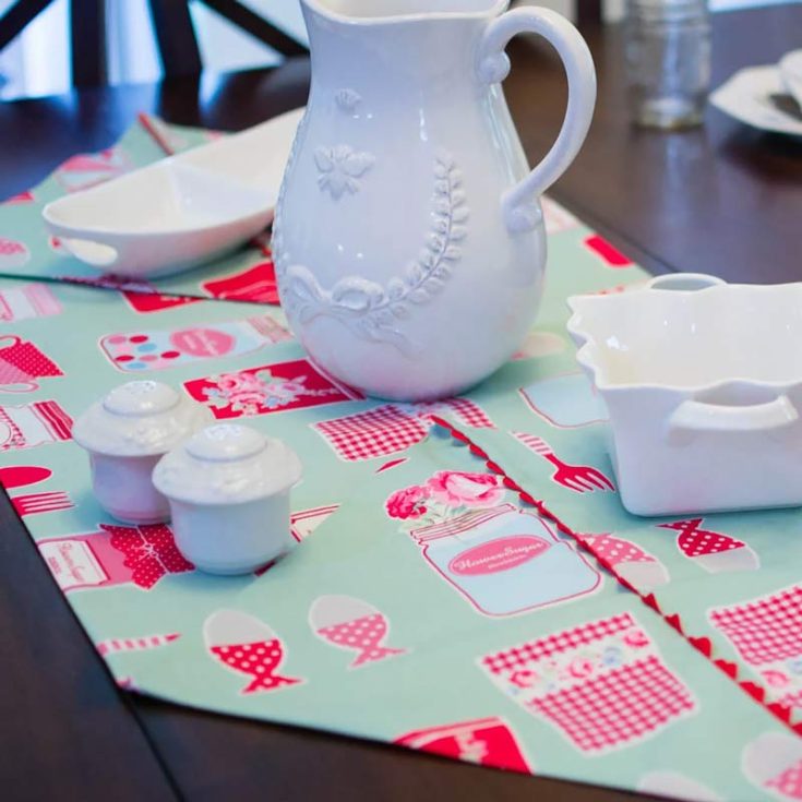 Sew yourself and your friends this beautiful runner design with just one yard of fabric and 5 minutes of your time! It's a fast and easy pattern that is folded back like origami at the ends, and the corners of the fabric are tacked down to hold them in place.&nbsp; Table runner size: 17" x 41"