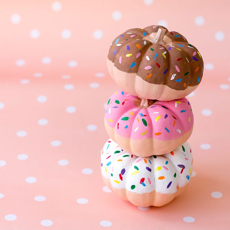 Utterly transform your pumpkins into these creative, colorful little donuts. These are such amazing mini pumpkin painting ideas. But be aware that your guests don't attempt to eat them!