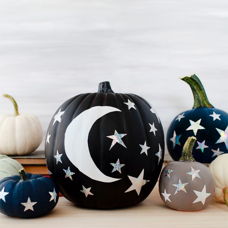 Achieve this starry night painted pumpkin look using paint and vinyl! These moon and stars cute pumpkin painting ideas can be used on both big and smaller pumpkins.