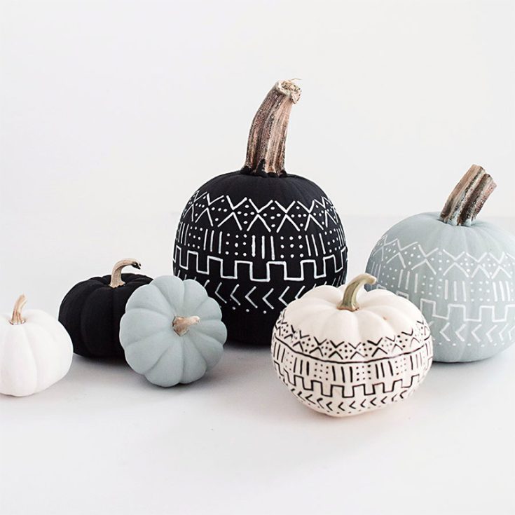 Here is another one of those creative pumpkin painting ideas for adults. If you're a fan of precision, symmetry, and geometry, this mud-cloth-inspired pumpkin is for you.