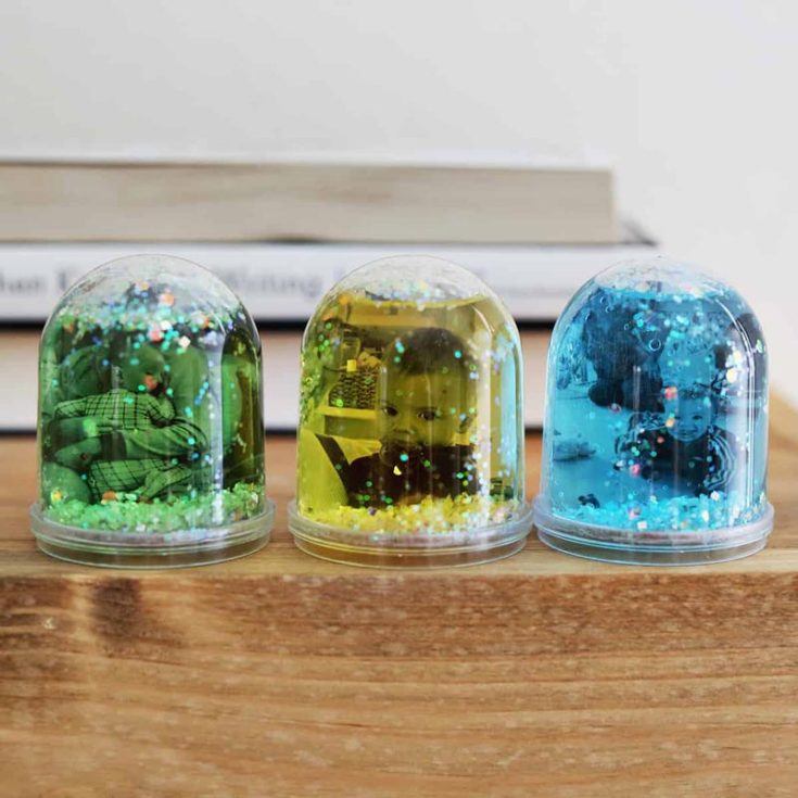 For this gift, it's the perfect time to bring up those old photo albums of your childhood spent with Mom. From fun family vacations to cute moments spent at the park, print them out and insert them into this DIY photo glitter globes. It&rsquo;s as easy as 1-2-3.