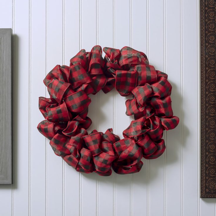 Want an easy DIY Ribbon Wreath in three easy steps? This tutorial is for you! Use different colored ribbons to make an array of colors, or just stick to one unison color.