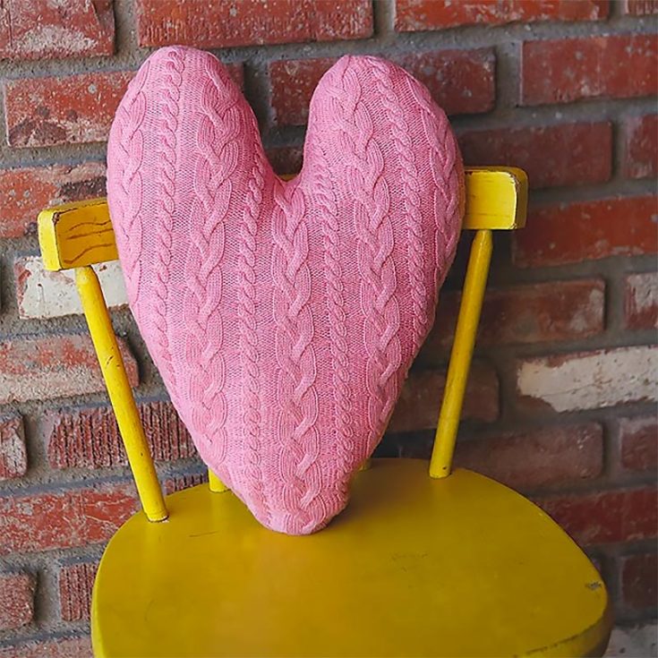 Repurpose all your old sweaters lying around into this beautiful heart-shaped pillow!