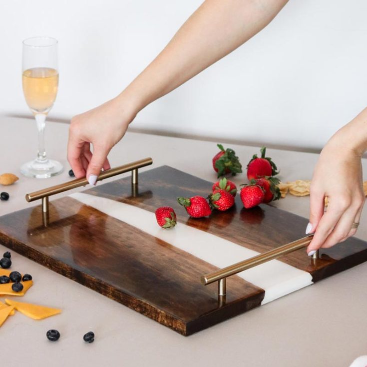Similar to the serving tray, here's another rendition of it! You can create this beautiful tray that will fit right into your kitchen decor using natural wood and resin.