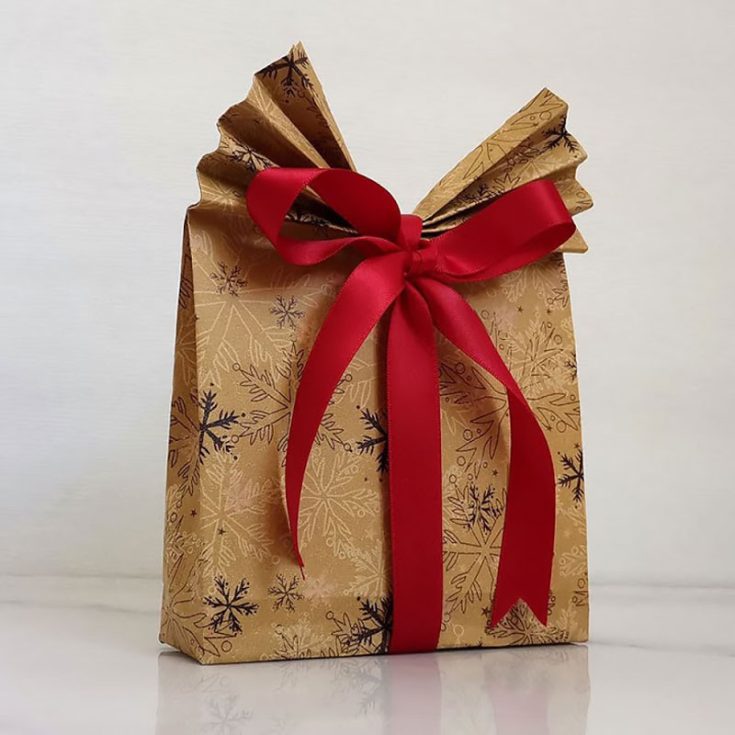 This simple and fun craft lets you whip up beautiful bags using wrapping paper, making them perfect for holidays, birthdays, especially if you have trouble wrapping those oddly shaped gifts.