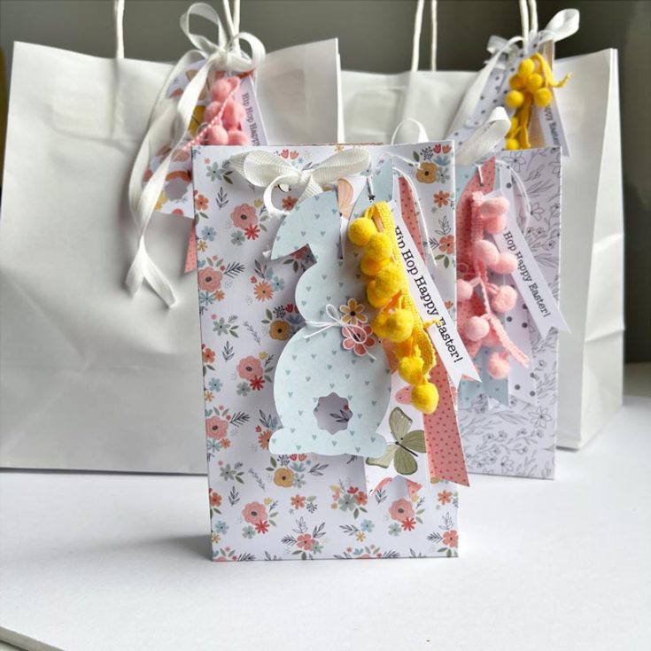 These Easter goodie bags are a burst of springtime fun! The real star is the adorable pastel bunny-shaped tags, dressed up with bows, pom-pom trim, and cut-out flowers, making them the cutest little bundles for your Easter celebration!