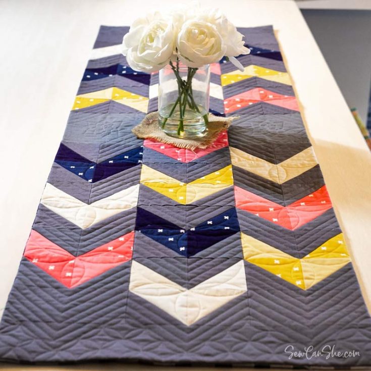 Learn how to make a table runner with this quilt design! It's an easy pattern that features HSTs to form a beautiful and modern striped piece for your table decor. It's a stash-buster project, so this design is ideal if you have any leftover fabric scraps.&nbsp; Table runner size: 18" x 54".&nbsp;