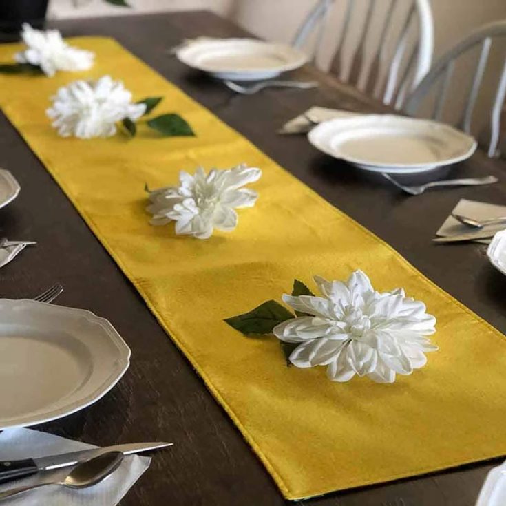 Sew this gorgeous and simple design that is catered to beginners! It's the perfect accent piece for Easter, Sunday dinners, and other special gatherings. It's reversible with a primary color on one side and a floral print fabric on the other.&nbsp; Table runner size: 14" x 72"&nbsp;