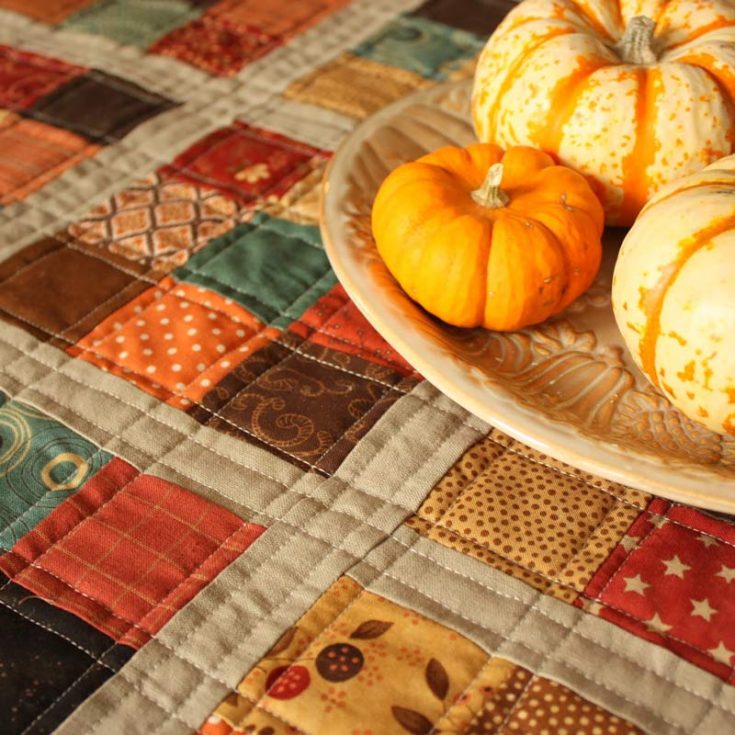 Though this design is a mini-quilt, it is also a runner that will look amazing on your tabletop. It will light up any room with a few prints from your stash. Add more fall colors to it, and voila, you'll have yourself the best fall decor in your home.&nbsp; Table runner size: Adjustable