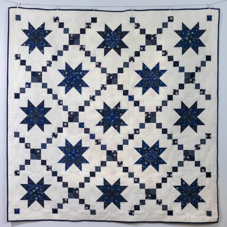Inspired by blue and white Amish quilts, this easy Variable Star Quilt is so breathtaking that it's a must-have on your quilt list! It features a traditional quilt block technique that is quite popular in the quilting world, and it consists of 13-star blocks and 12 Irish chain blocks that result in a classic-looking quilt. The finished size of this stash-buster project is 76" x 76" throw.&nbsp;