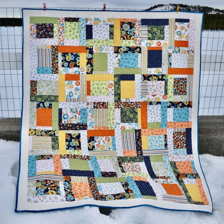 Learn to quilt this delightful quilt design to snuggle in by the fireplace during those cold, chilly nights! It&rsquo;s a design that is ideal for beginners, and this pattern comes with both a written guide and a video tutorial for a smoother quilting journey. The final measurements yield a 55 &frac12;&rdquo; x 64&rdquo; quilt.
