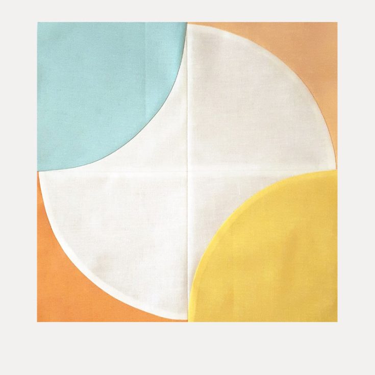 This Fizzy quilt block from Blossom Heart Quilts adds a magical twist to the good-ol drunkard's path quilt block! The unique placement of curves adds an artsy pop to the finished quilt piece.