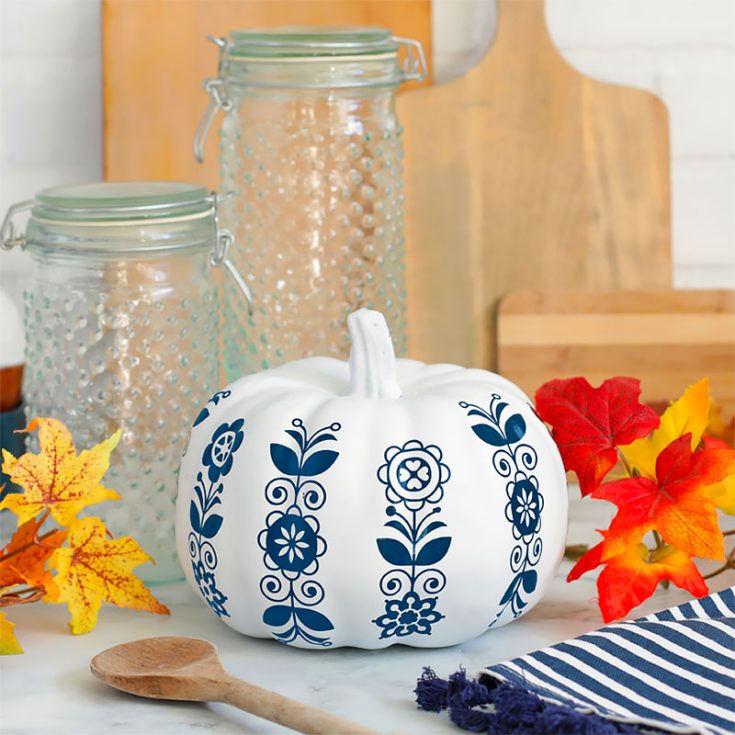 These one-of-a-kind designs are inspired by Mexican and Scandinavian folk art. Create a charming table centerpiece with some adhesive craft vinyl and some fake pumpkins.