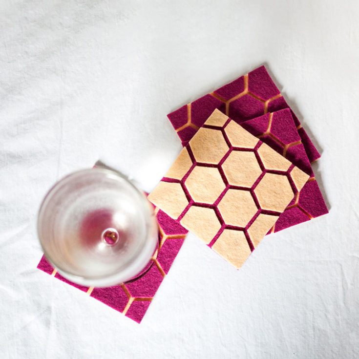 These creative geometric coasters bring a touch of geometry to your living space! Cut out felt hexagons and stick them onto a contrasting color base to make these fun shapes pop with color!