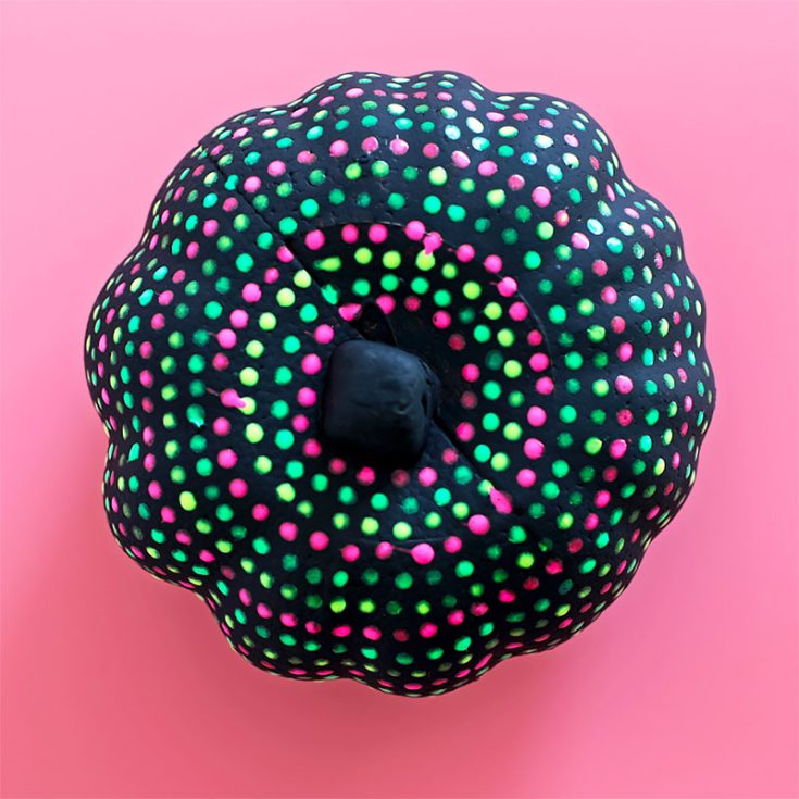 We're all about statement pieces here. And what could be more iconic than a glow-in-the-dark painted pumpkin perching on your front porch?