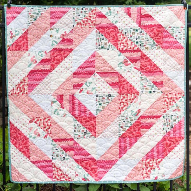 This half-square triangle baby quilt by Polka Dot Chair is so breathtaking! Though the pattern is simple, the playful layouts and vibrant colors bring so much life to any nursery decor! The finished quilt size is 48&rdquo; x 48&rdquo;.