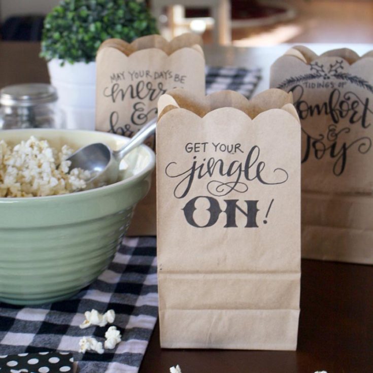 Add a personal touch to your gift wrapping with hand-lettered holiday goodie bags! Handletter your favorite festive phrases and print them onto simple brown paper bags for a fun, custom look.