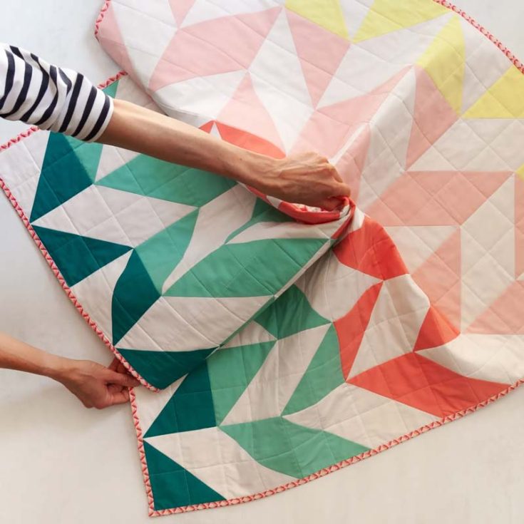 Check out this absolute darling of a quilt! This stunning ombre Herringbone Quilt is a fast sewing project, and it shows you a bunch of different color layouts to spoil you for choice. Though this triangle quilt pattern will guide you into making a 40&rdquo; x 40&rdquo; baby quilt, it&rsquo;s easily customizable by adding more HST blocks to create your desired quilt size.