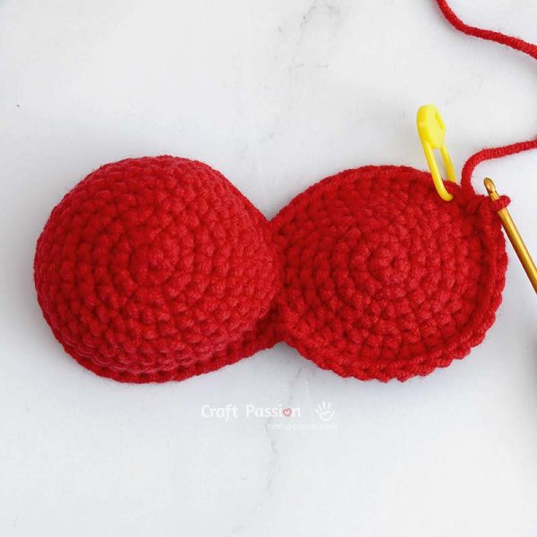 Sewing the gap closed between the two bumps of the heart