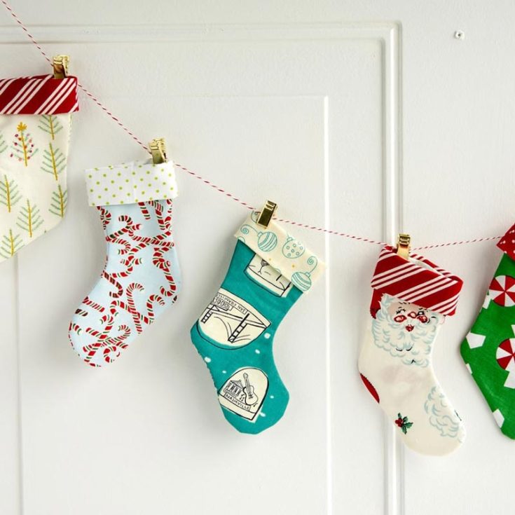 Deck the halls with the charm of crafting this cute design by Polkadot Chair. Check out their adorable rendition of Christmas decor with a mini Christmas stocking garland that adds festive flair in a snap! String together these adorable stockings for a cute and cheerful holiday vibe.