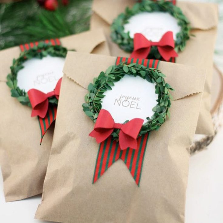 Mini wreaths are a cute way to jazz up your gift bags, and you can easily find them at the craft store or online. Adorn some adorable ribbons and bows, and you&rsquo;ll have festive bags your friends and family will love.