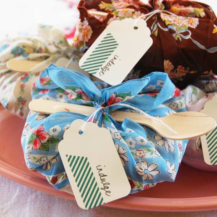 Add a delightful touch to your next gathering with these miniature pie party favors. Wrapped in vintage handkerchiefs, these little treats not only look charming but also bring a personal touch to your celebrations.