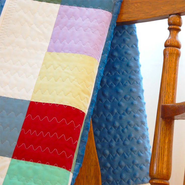 A baby's comfort is of utmost importance when it comes to making a baby quilt. This 40.5? x 40.5? Minky-backed quilt is based on nine patch blocks so it's great for beginners too! The super soft fleece fabric and extra batting in between would provide warmth for your baby.