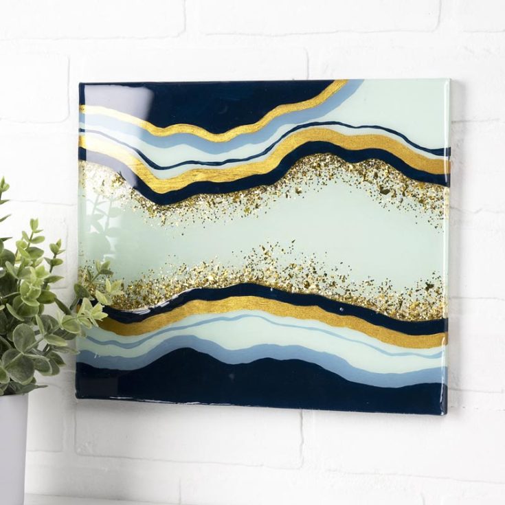 Learn to make this Mod Podge Geode wood sign as home decor! They're irresistible and would make for pretty gifts to a special someone.