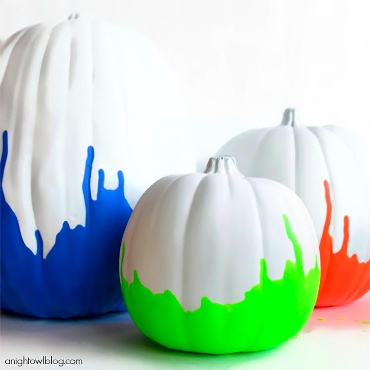 We had splattered pumpkins and crayon bleeding pumpkins, and now we present to you dipped neon pumpkins. Mix all these brightly colored pumpkins for a huge burst of color this fall.