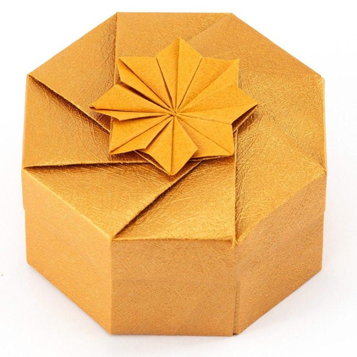 This beautiful gift box is the perfect tutorial for gifts that you plan to spoil your loved ones with. Try using some textured paper for a more grandiose feel. We recommend using gold dust origami paper!