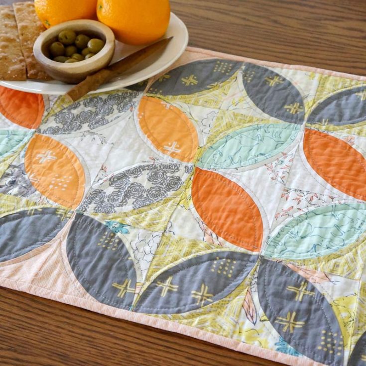 Whether you're making it for fall or any holiday season, this intermediate quilt project is fat quarter-friendly and a classic favorite that will bring attention to your dining table. It has easy-to-follow instructions and templates for curved piecing.&nbsp; Table runner size: 16 &frac12;" x 72 &frac12;"