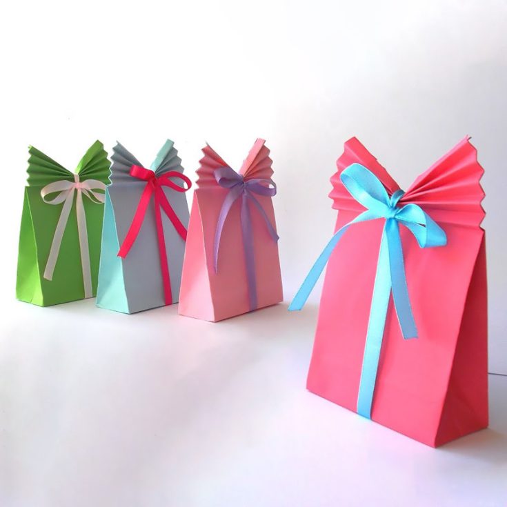 These DIY paper gift bags are incredibly stylish with their fan-like folded tops and colorful ribbons. They're such a fun and easy way to add a handmade touch to your gifts!