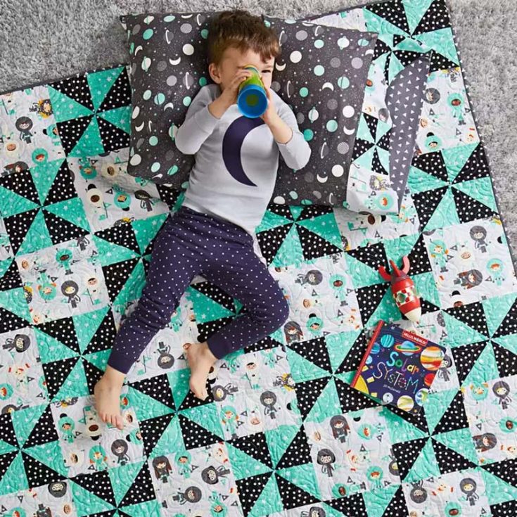 Try out this baby quilt design that comes in three sizes in the downloaded PDF! Made with charming pinwheel blocks and adorable animal appliques, quilt up a snuggly masterpiece that will delight both kids and adults at the same time. The finished quilt size is 56 &frac12;&rdquo; x 72 &frac12;&rdquo;.