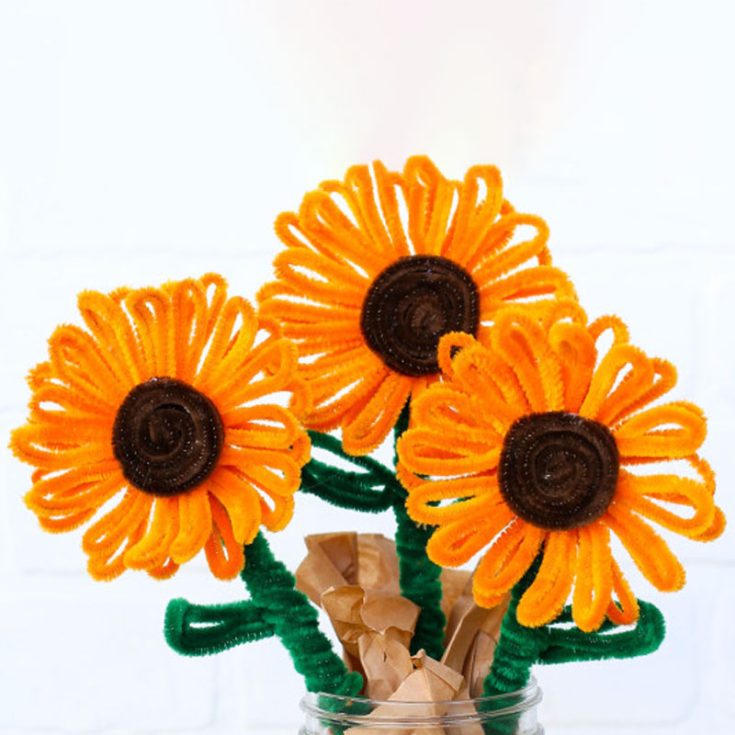 With their bold yellow petals and dark brown centers, these cheerful sunflower blooms are a vibrant addition to any floral arrangement.