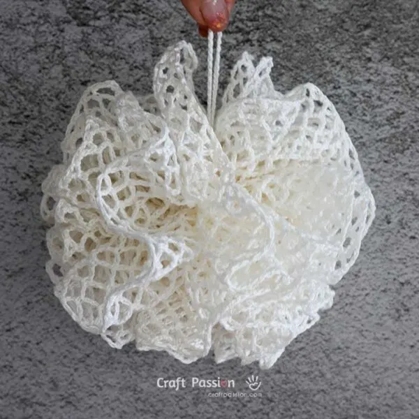 pouf washcloth crochet pattern DIY your own shower scrubbie with this easy, beginner-friendly crochet loofah pattern. Great as a washcloth or bath pouf for everyday use or gifts!